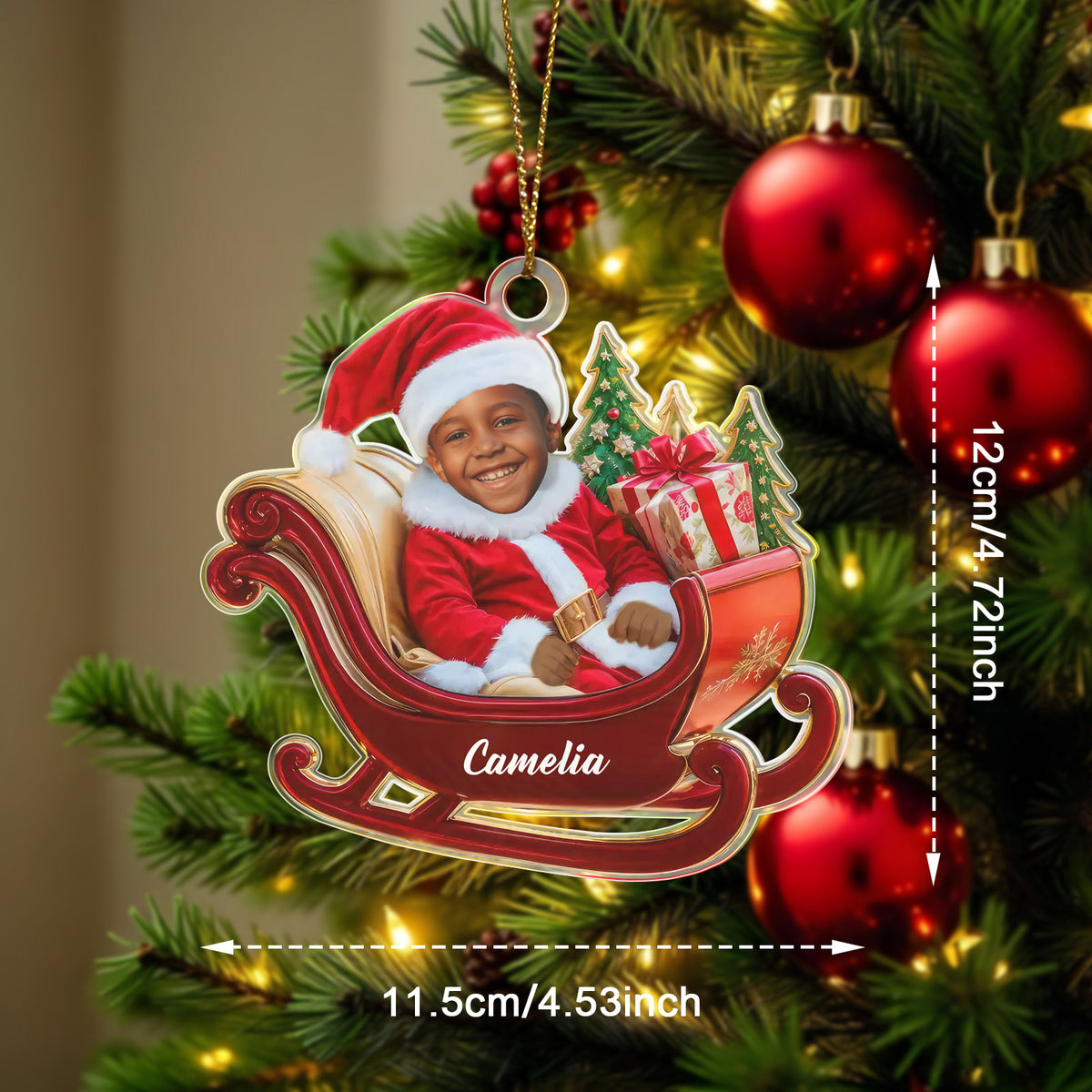 Personalized Christmas ornament of a child in a sleigh with measurements on a decorated tree.