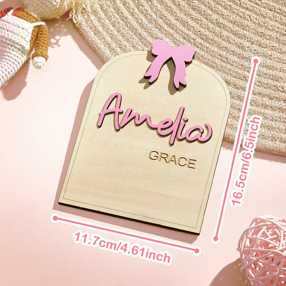 Personalized nameplate with 'Amelia Grace' on a pink background with measurements.
