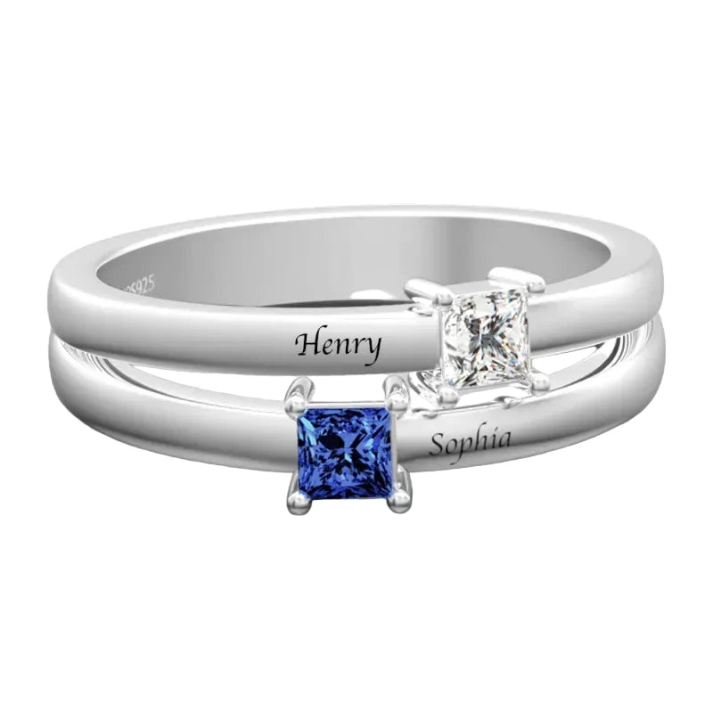 Two diamond rings with engraved names on a white background
