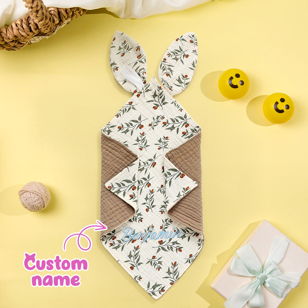Floral-patterned bunny-shaped mat on a yellow background with decorative elements.