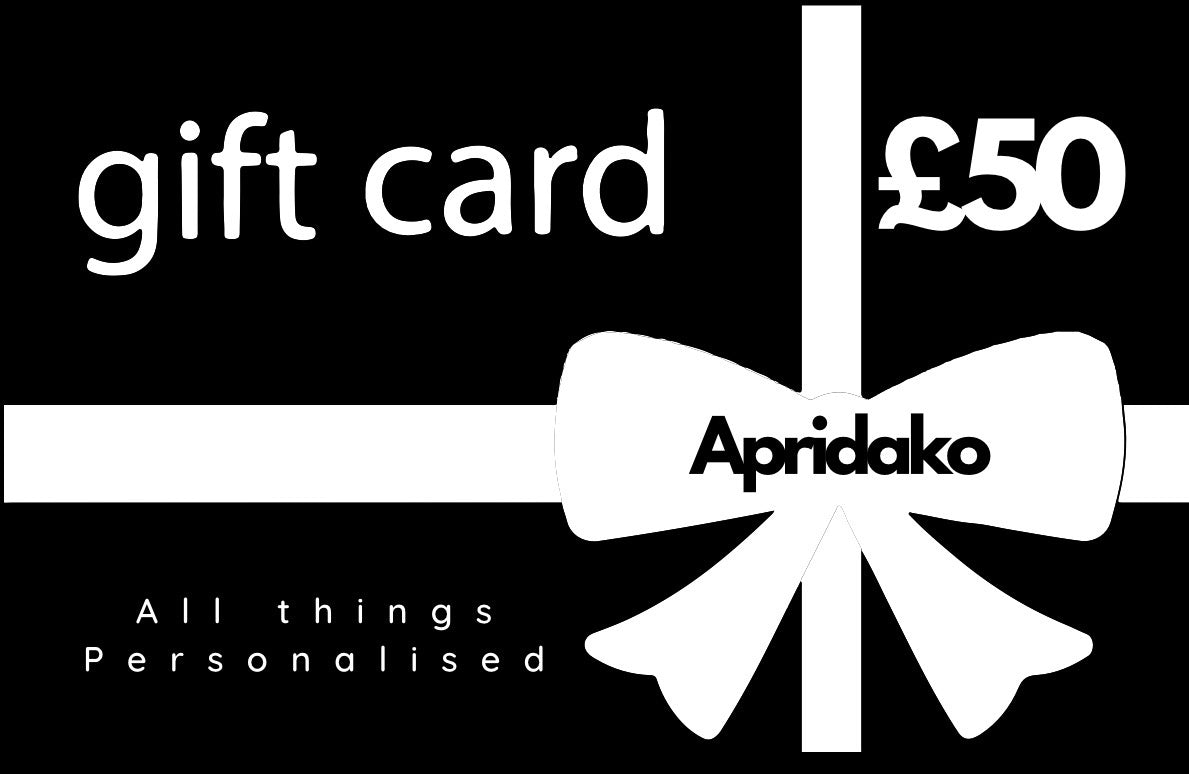 Gift card with a white bow and 'Apridako' branding on a black background