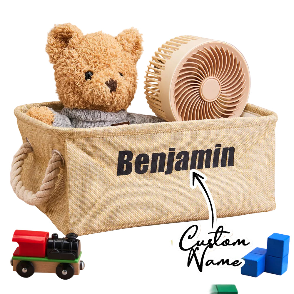 Toy basket with teddy bear, wooden fan, and toys on a beige background