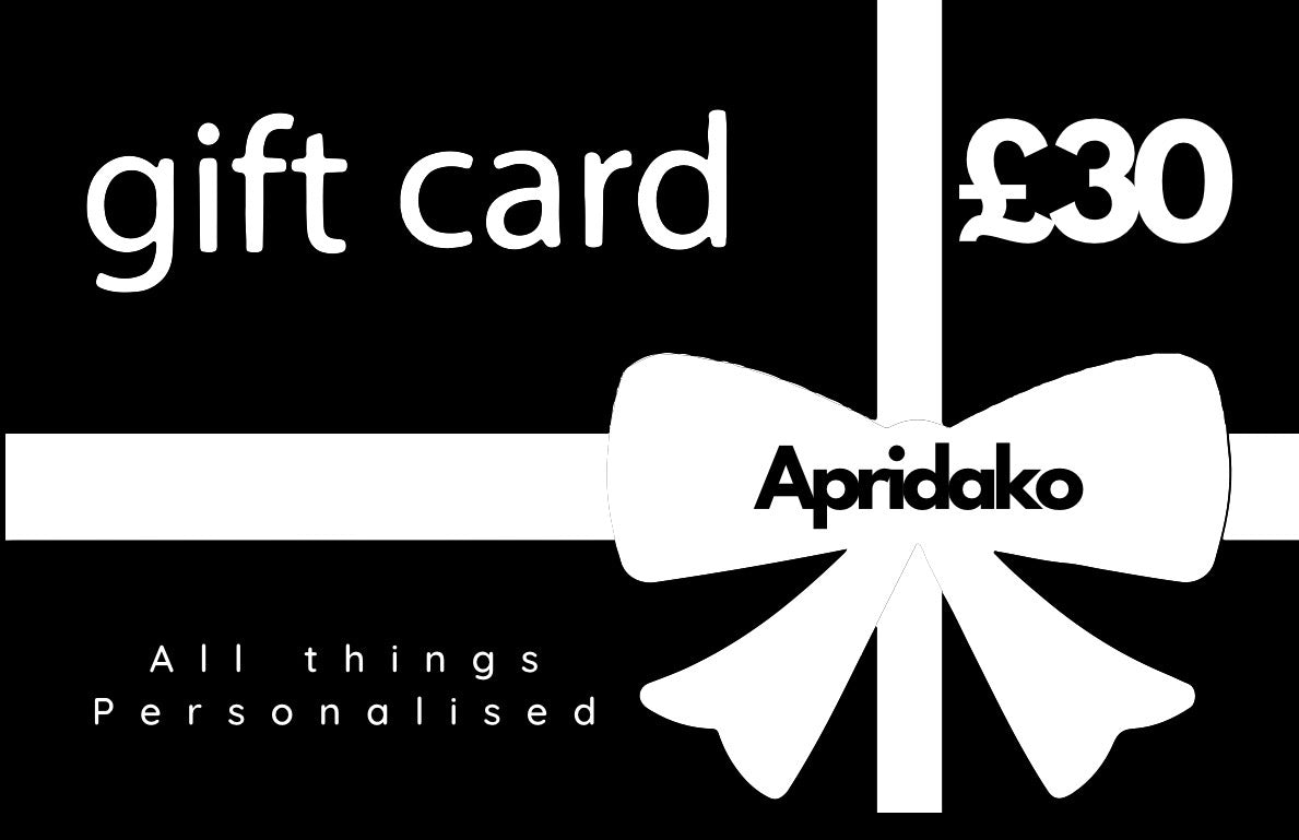 Gift card with a white bow and 'Apridako' branding on a black background
