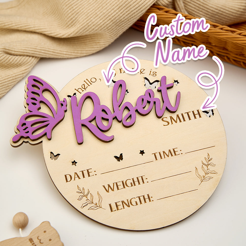 Wooden baby milestone plaque with butterfly design and customizable text on a neutral background