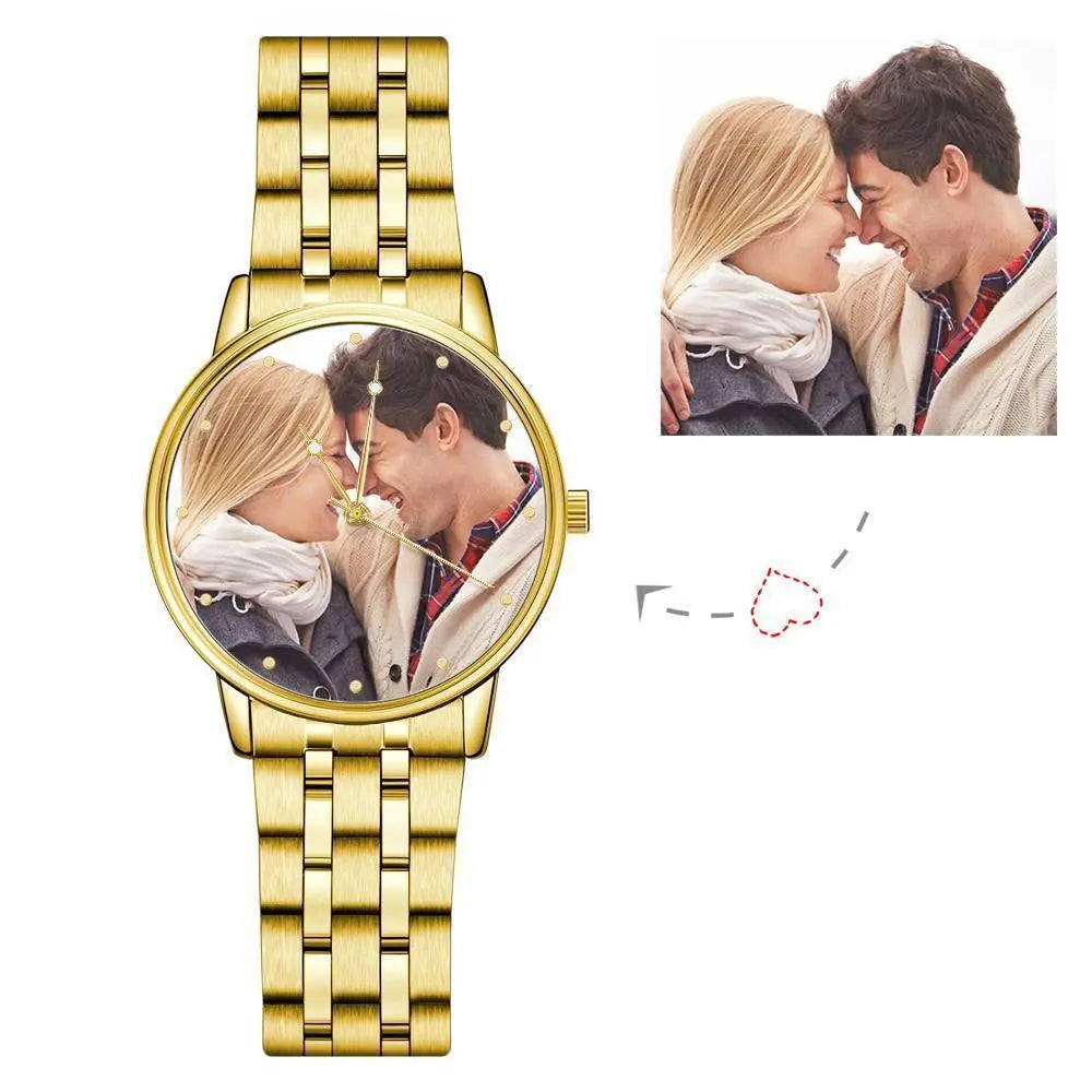 Gold watch with a photo of a couple on the dial, inset image of the couple embracing.