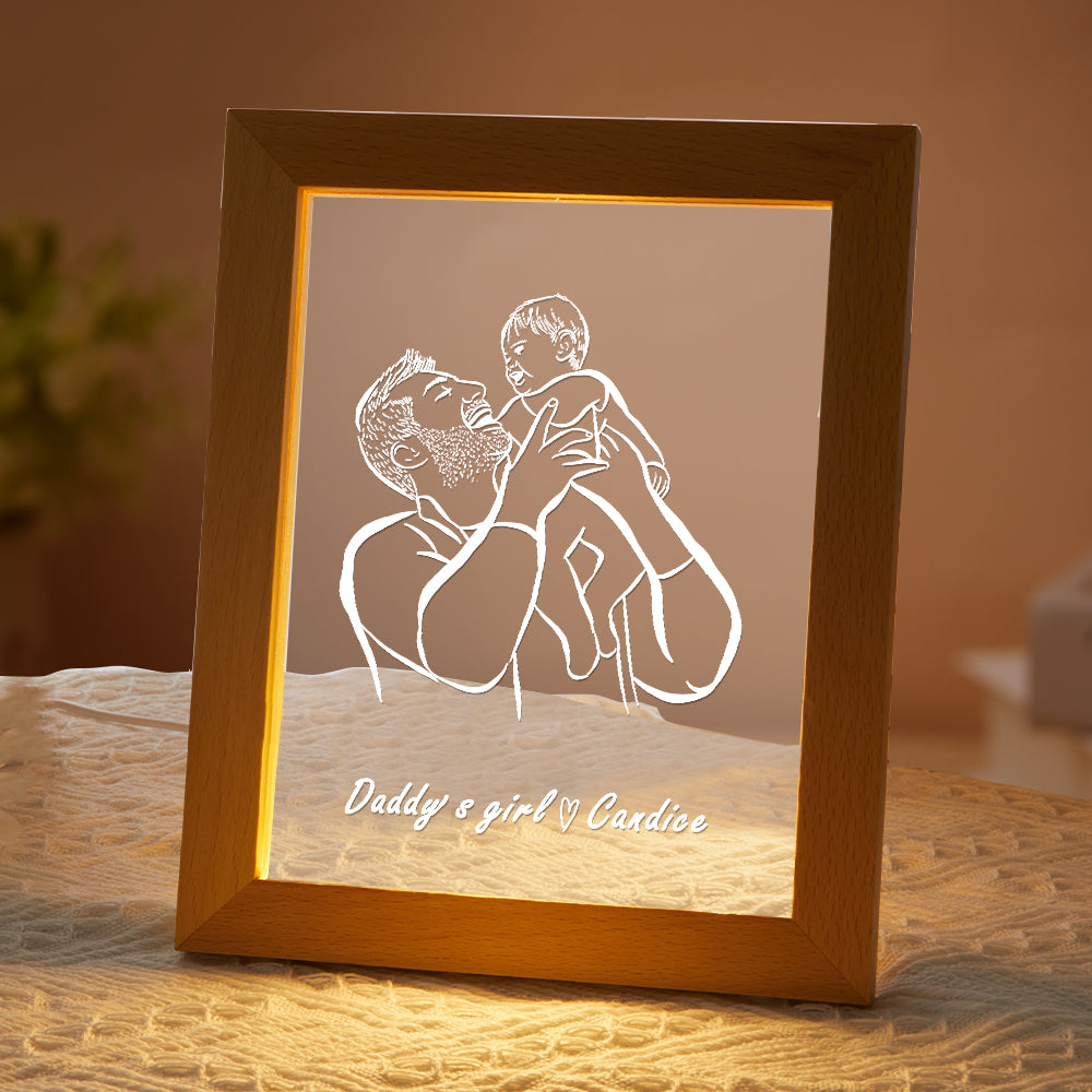 Framed artwork of a father and child holding each other with 'Daddy & girl Cardice' text, illuminated from behind.