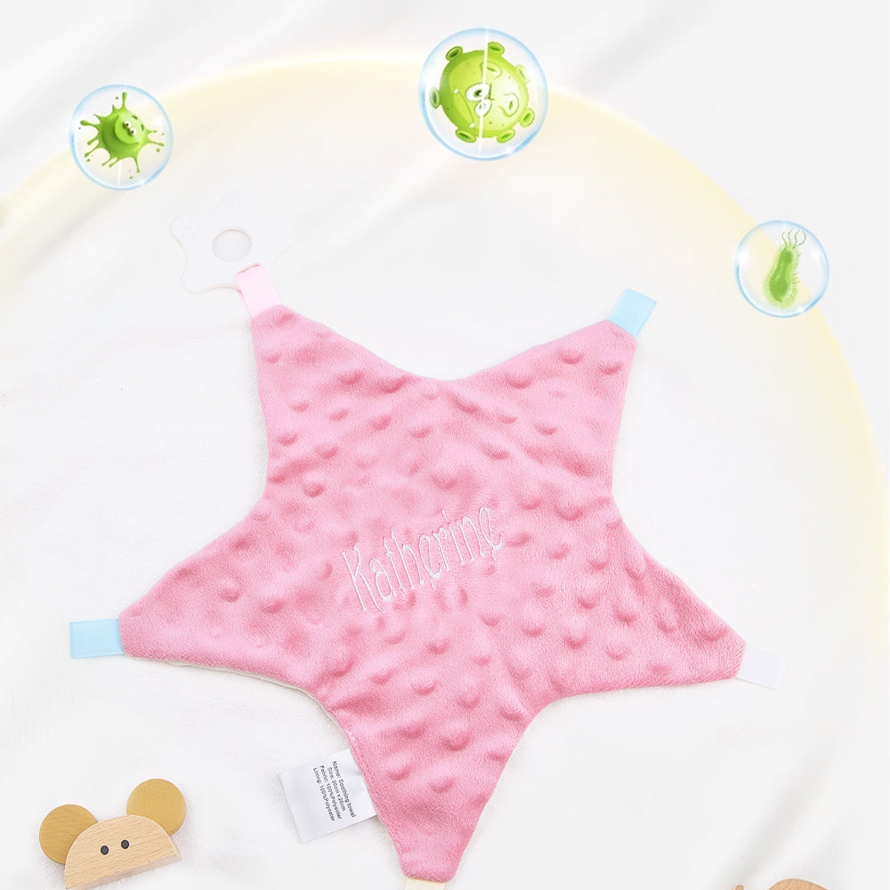 Pink star-shaped towel with 'Katherine' embroidered on it, displayed against a white background.