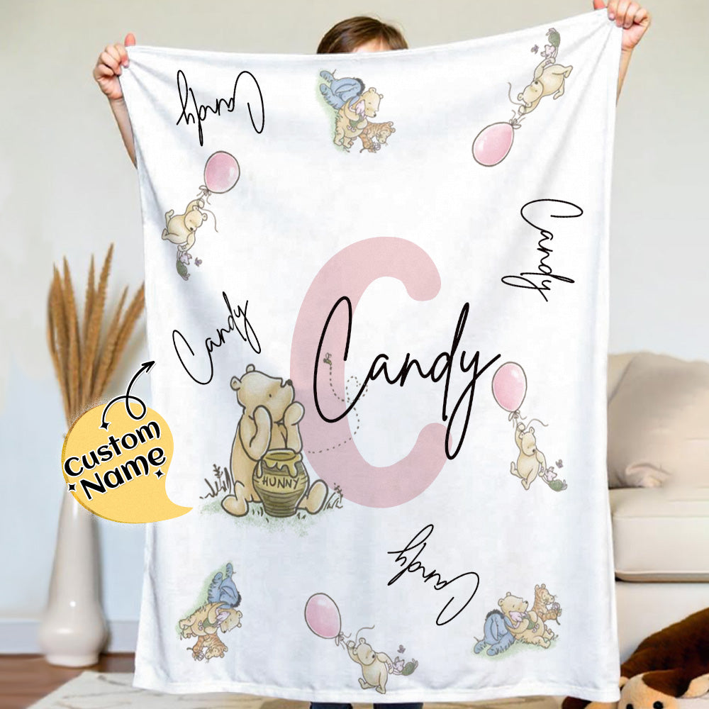 Person holding a blanket with cartoon characters and 'Candy' text, with a decorative element on a light background.