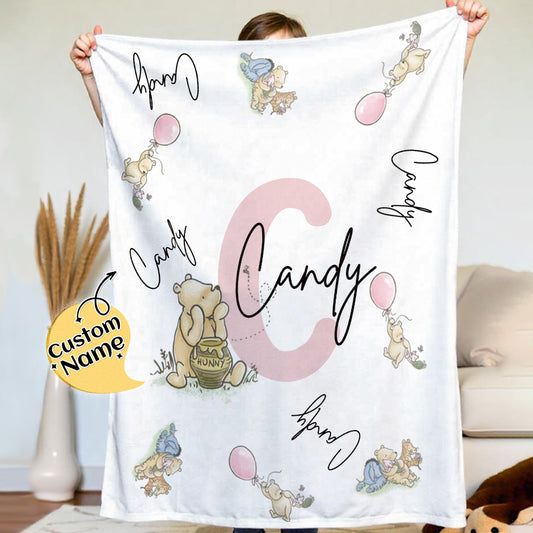 Person holding a blanket with cartoon characters and 'Candy' text, with a decorative element on a light background.