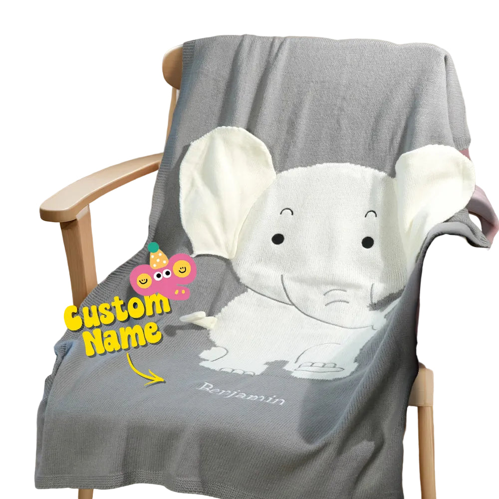 Gray blanket with elephant design on a chair, featuring a customizable name.
