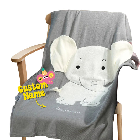 Gray blanket with elephant design on a chair, featuring a customizable name.
