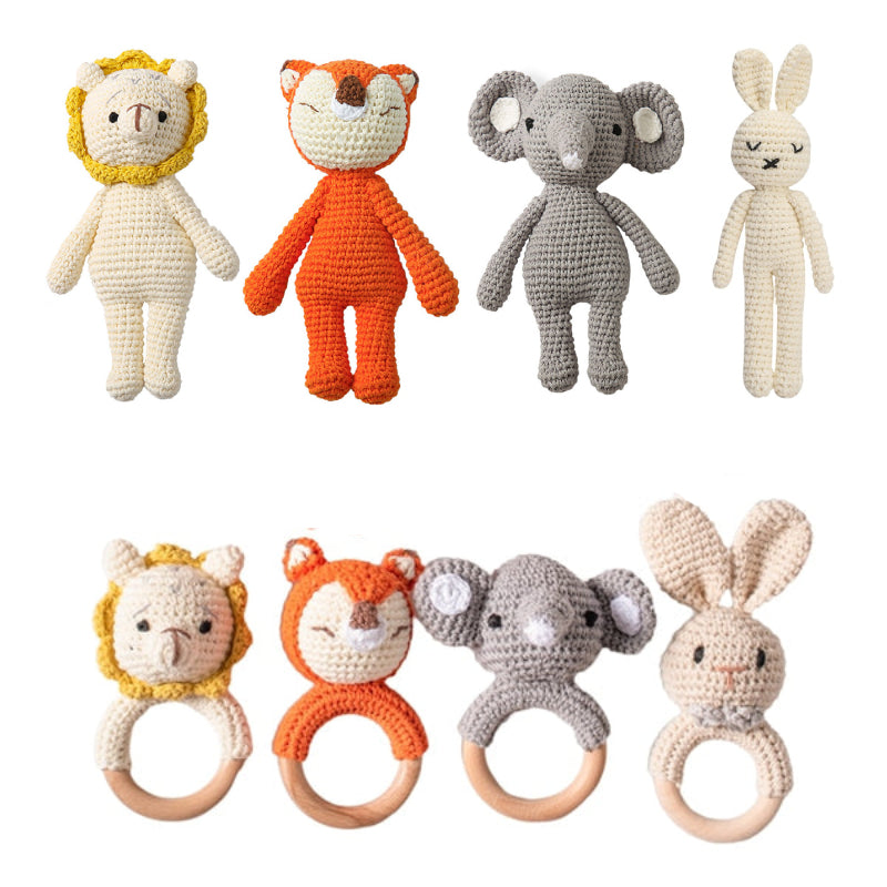 Set of crochet animal toys and rattle toys on a white background