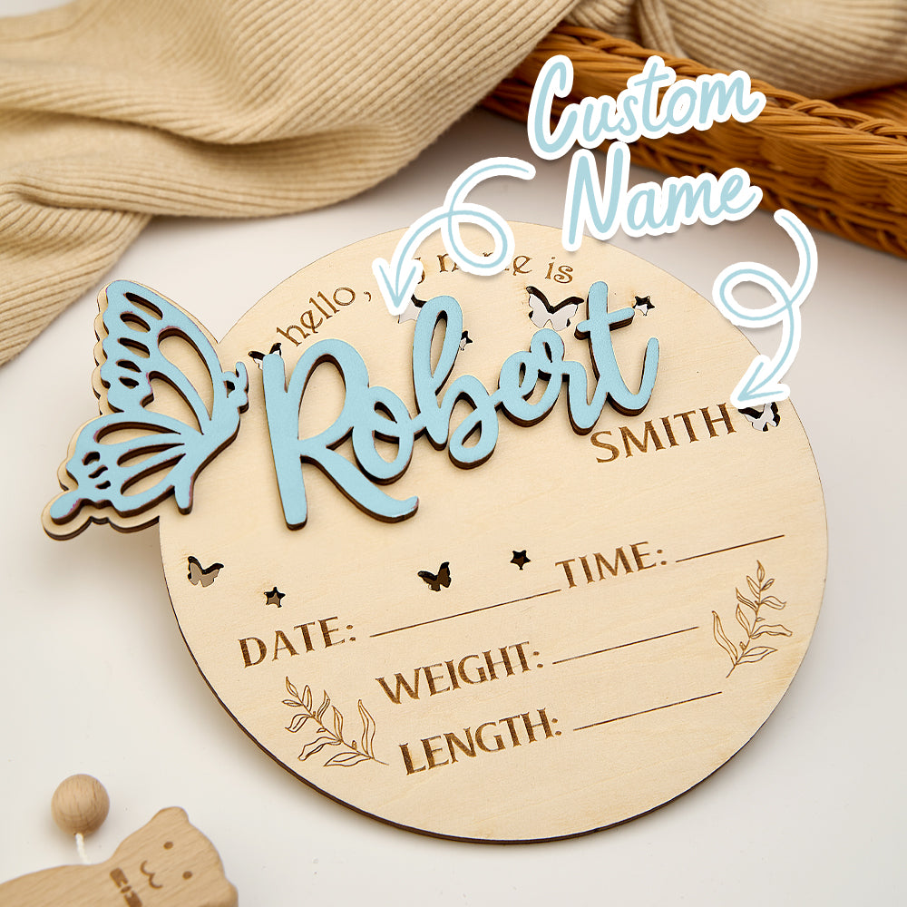 Wooden baby announcement plaque with customizable name and details on a neutral background