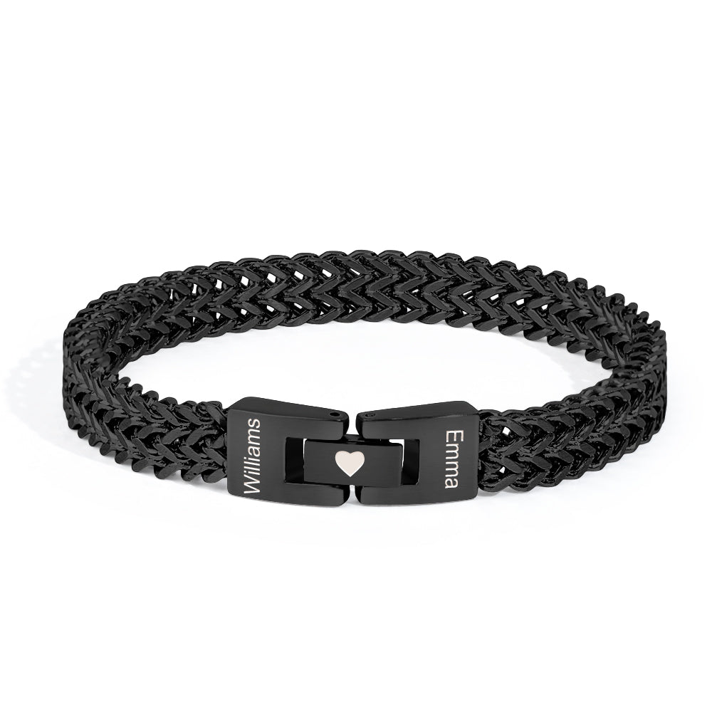 Black braided bracelet with engraved names on a white background