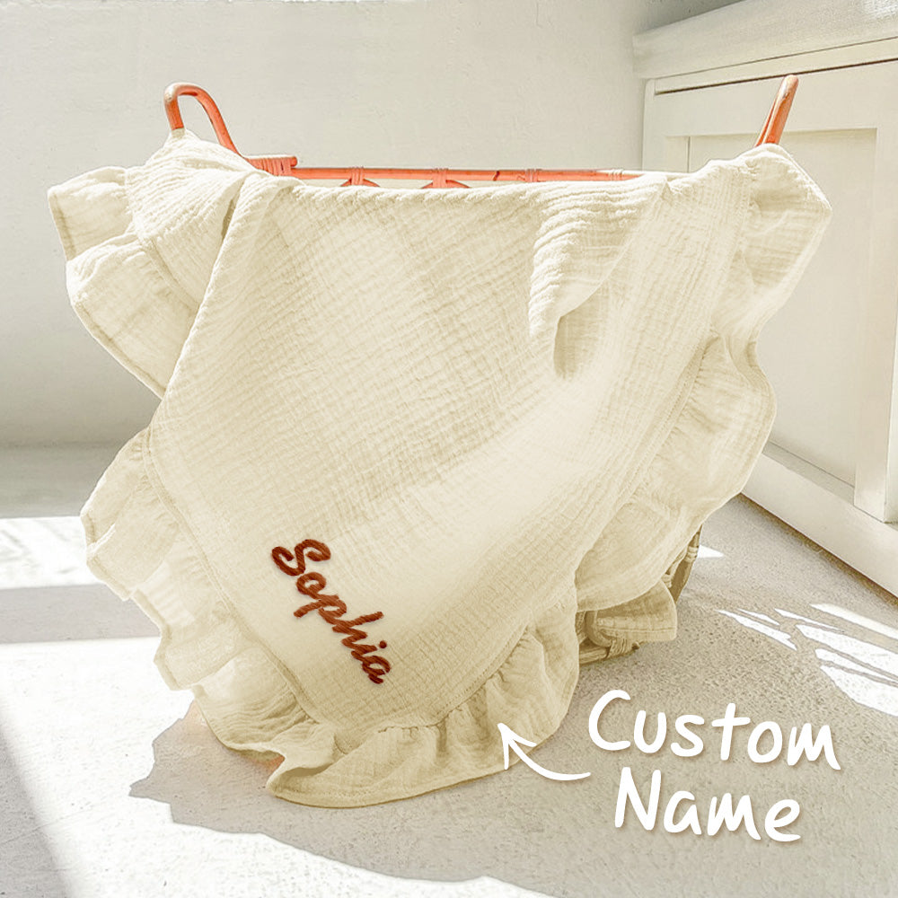 White ruffled skirt with 'Sophia' embroidered on it, hanging on a rack.