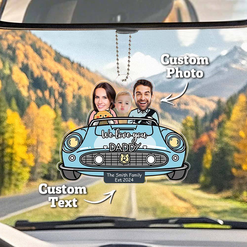 Car rearview mirror with personalized photo and text of a family in a car, set against a scenic mountain backdrop.