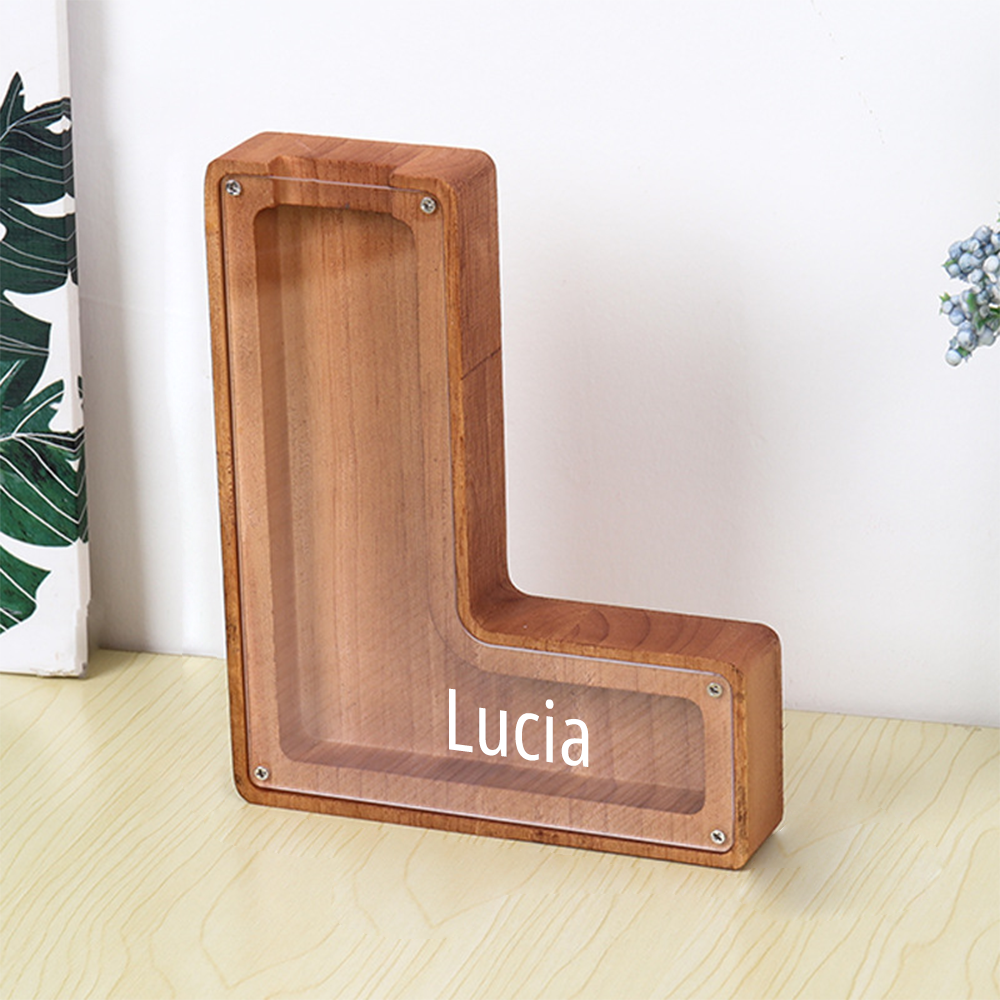 Wooden pet ramp with 'Lucia' engraved on a light wooden floor.