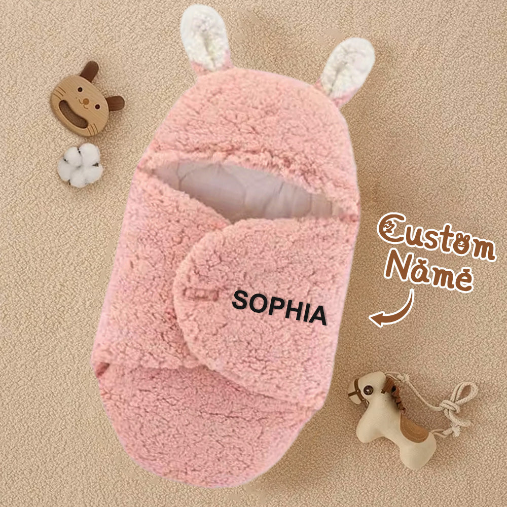 Pink plush slippers with bunny ears on a beige background, featuring the name 'SOPHIA'.