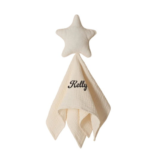 Star-shape with a folded corner and 'Kelly' embroidered on a beige background