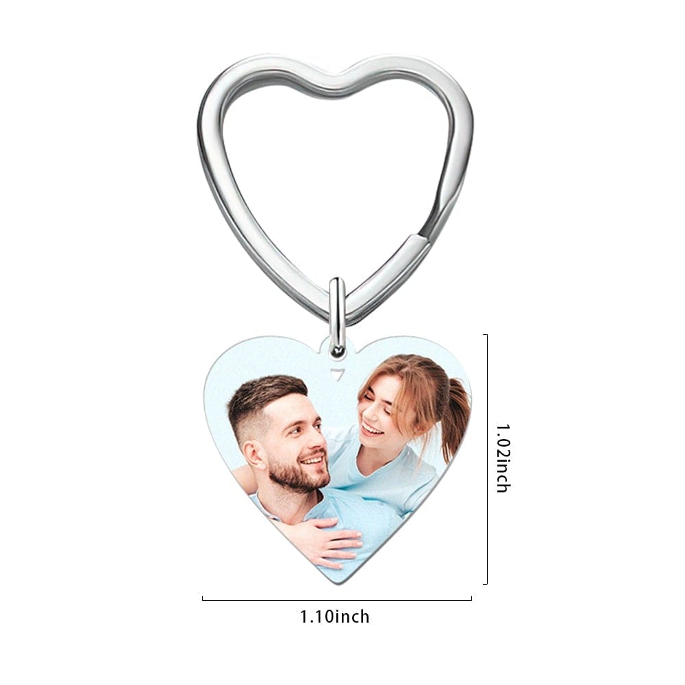Heart-shaped keychain with a photo of a couple on a white background