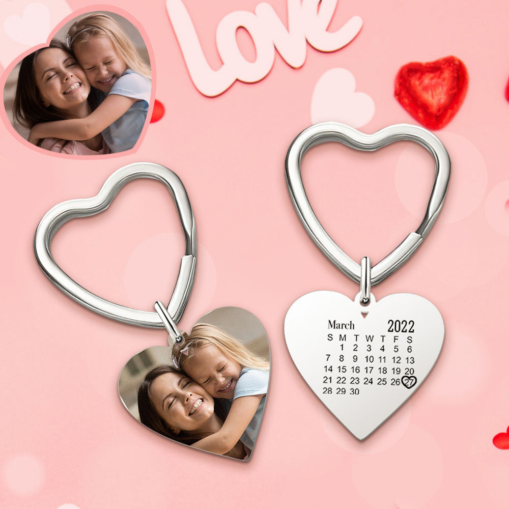Heart-shaped keychains with photo and calendar on a pink background with 'Love' text