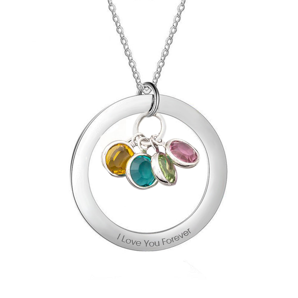 Silver necklace with circular pendant and colored gemstones on a white background