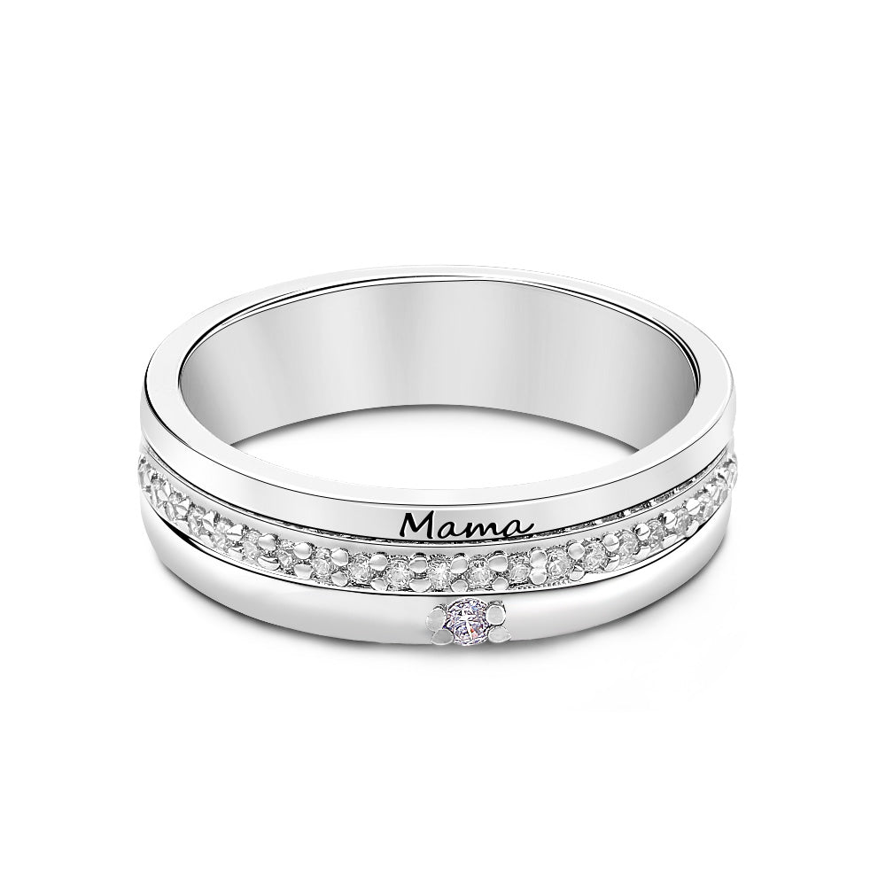 Silver ring with 'Mama' engraving on a white background
