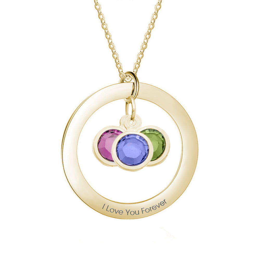 Gold necklace with circular pendant featuring purple, blue, and green stones on a white background