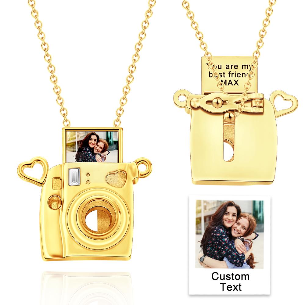 Gold camera-shaped pendant with a chain, featuring a photo insert and customizable text on a white background.