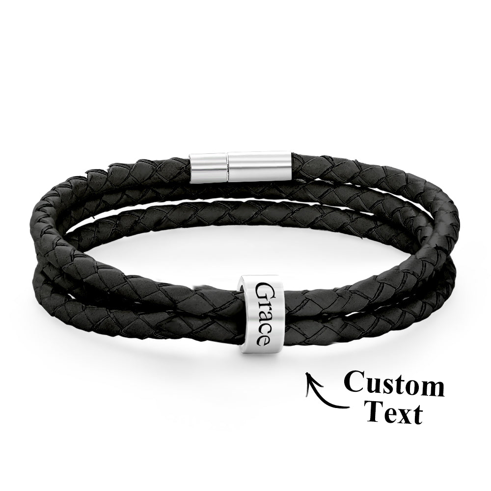 Black braided leather bracelet with a silver clasp on a white background