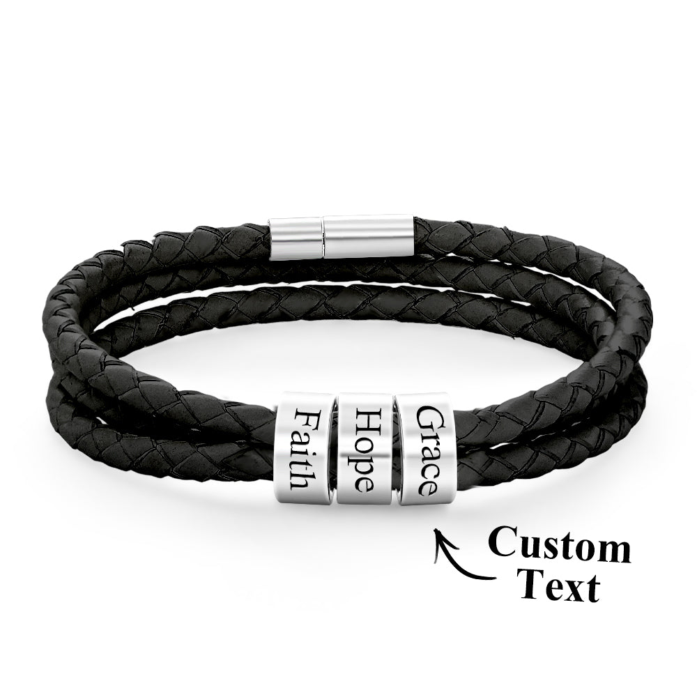 Black braided leather bracelet with silver cylindrical beads displaying 'Faith', 'Hope', and 'Grace'.