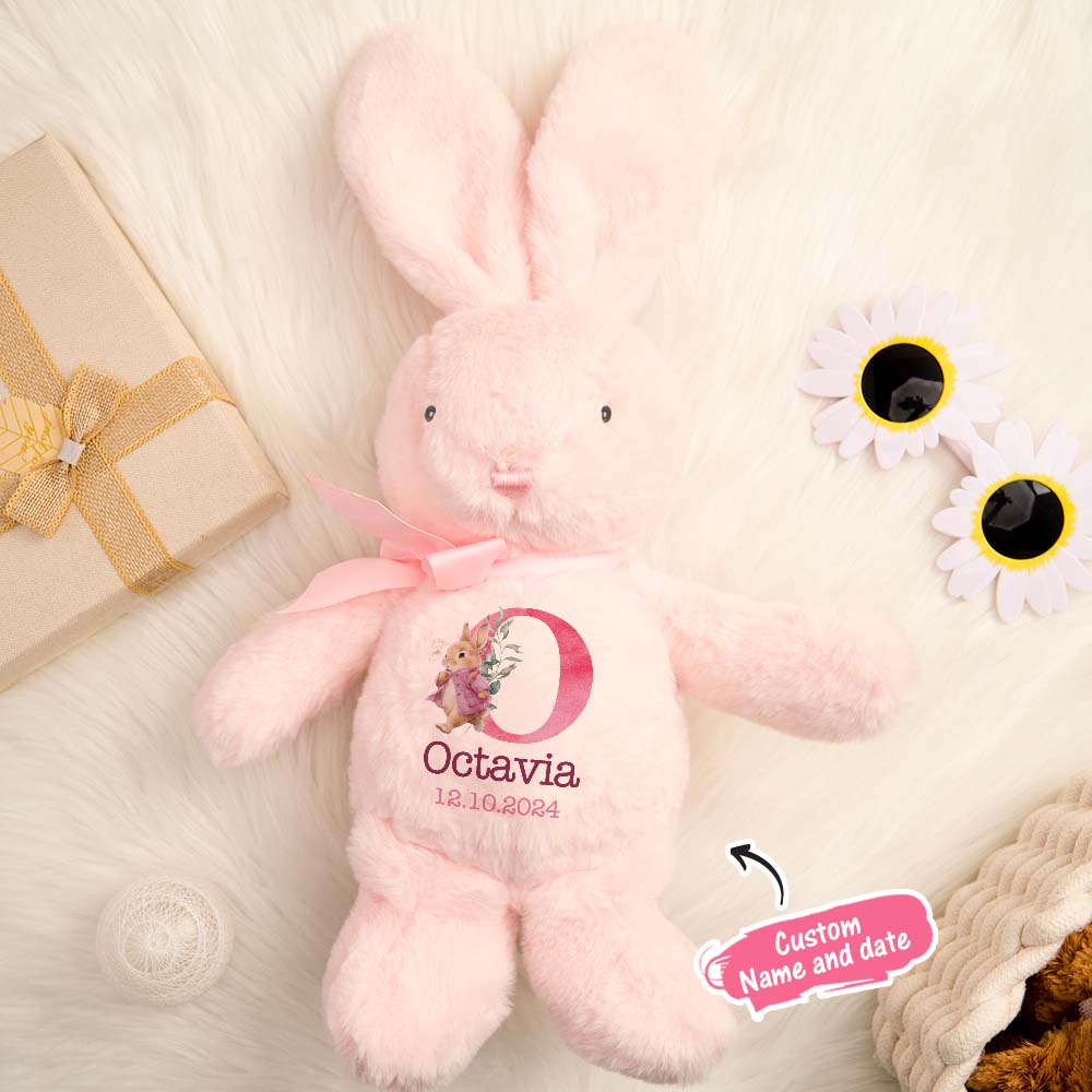 Pink plush bunny with 'Octavia' and a date on a light background