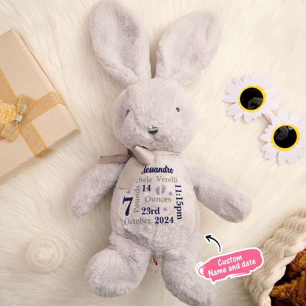 Gray plush bunny with personalized text on a light background