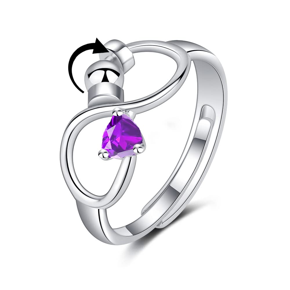 Silver ring with a purple heart-shaped gemstone on a white background