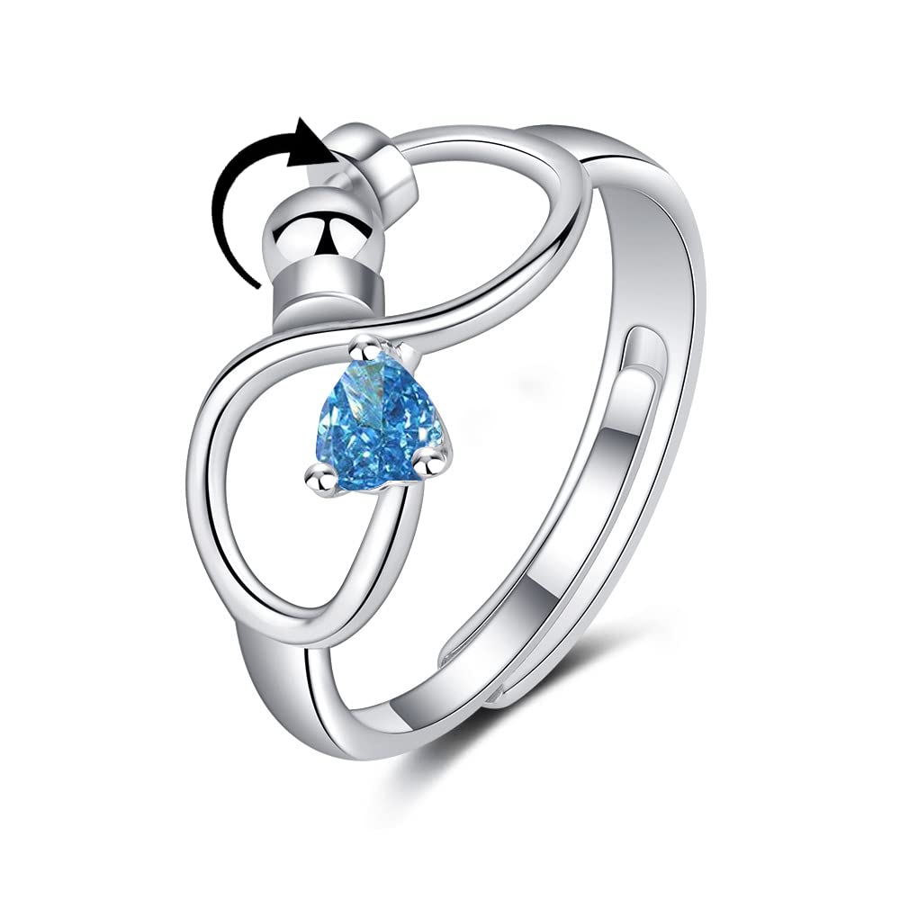 Silver ring with a blue gemstone on a white background