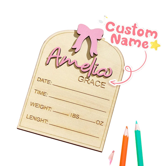 Baby announcement card with 'Amelia Grace' on a pink background, accompanied by colorful pencils.