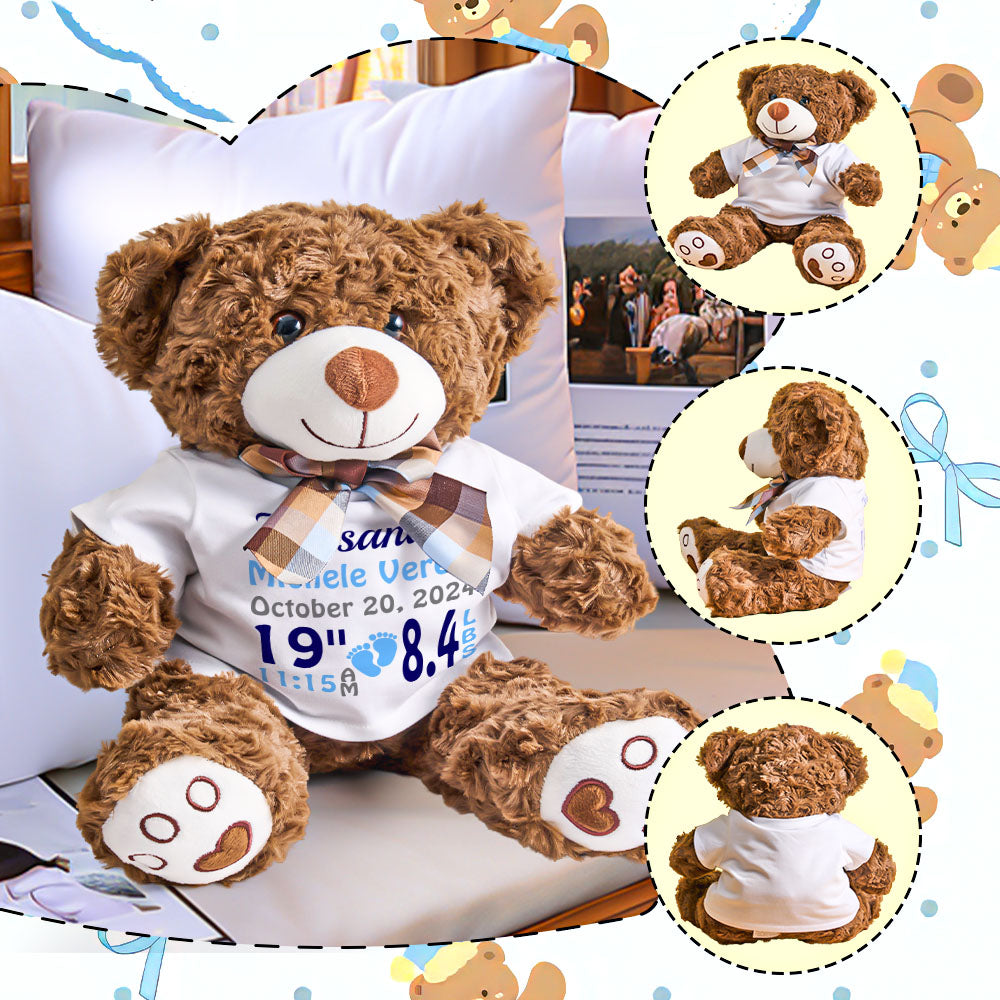 Brown teddy bear wearing a white shirt with text, sitting on a white surface.