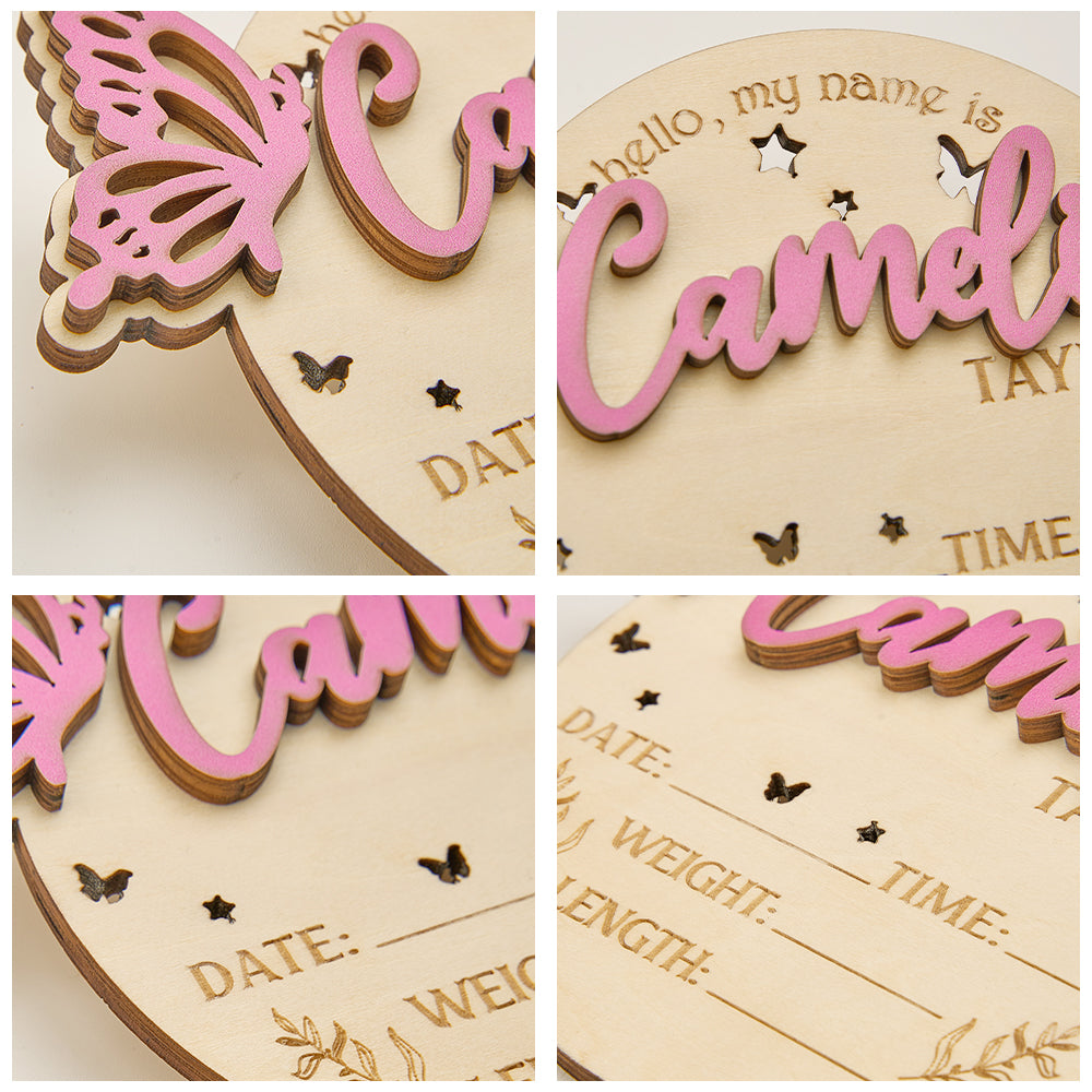 Wooden baby announcement plaque with pink butterfly design and engraved text.