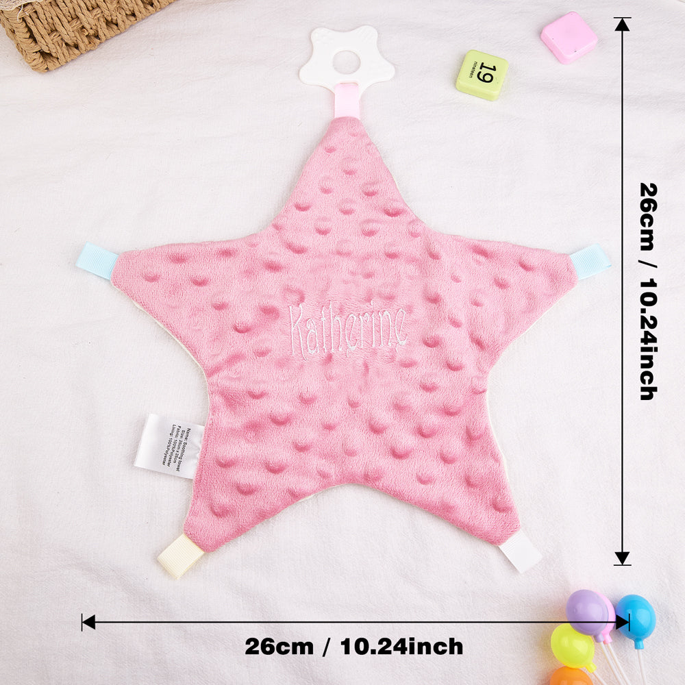 Pink star-shaped baby comfort blanket with 'Katherine' embroidered on it, displayed with measurements.