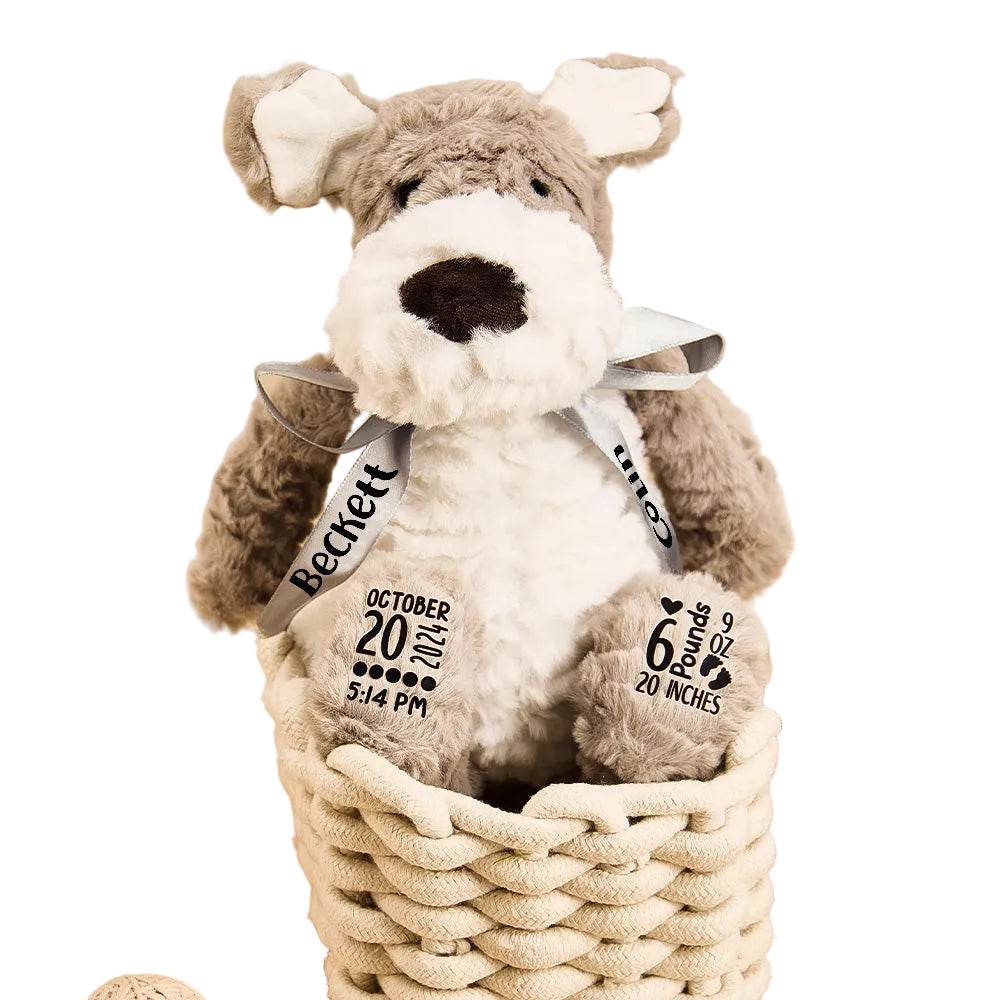 Plush dog toy with personalized details in a woven basket on a wooden surface.