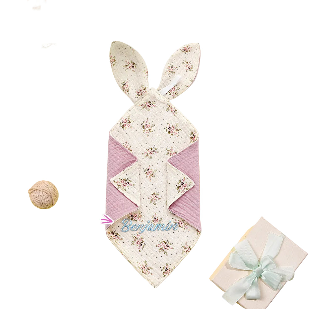 Floral bunny-shaped towel with 'Benjamin' on a yellow background