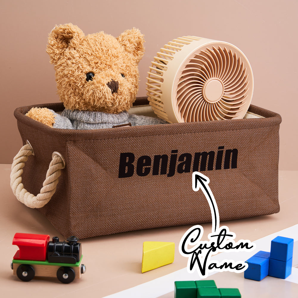 Brown storage basket with teddy bear, toy train, and blocks on a beige background
