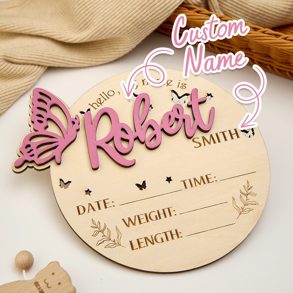 Wooden baby announcement plaque with customizable text on a neutral background