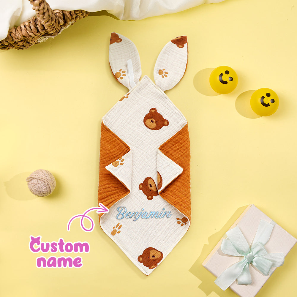 Baby blanket with teddy bear design and 'Custom name' text on a yellow background