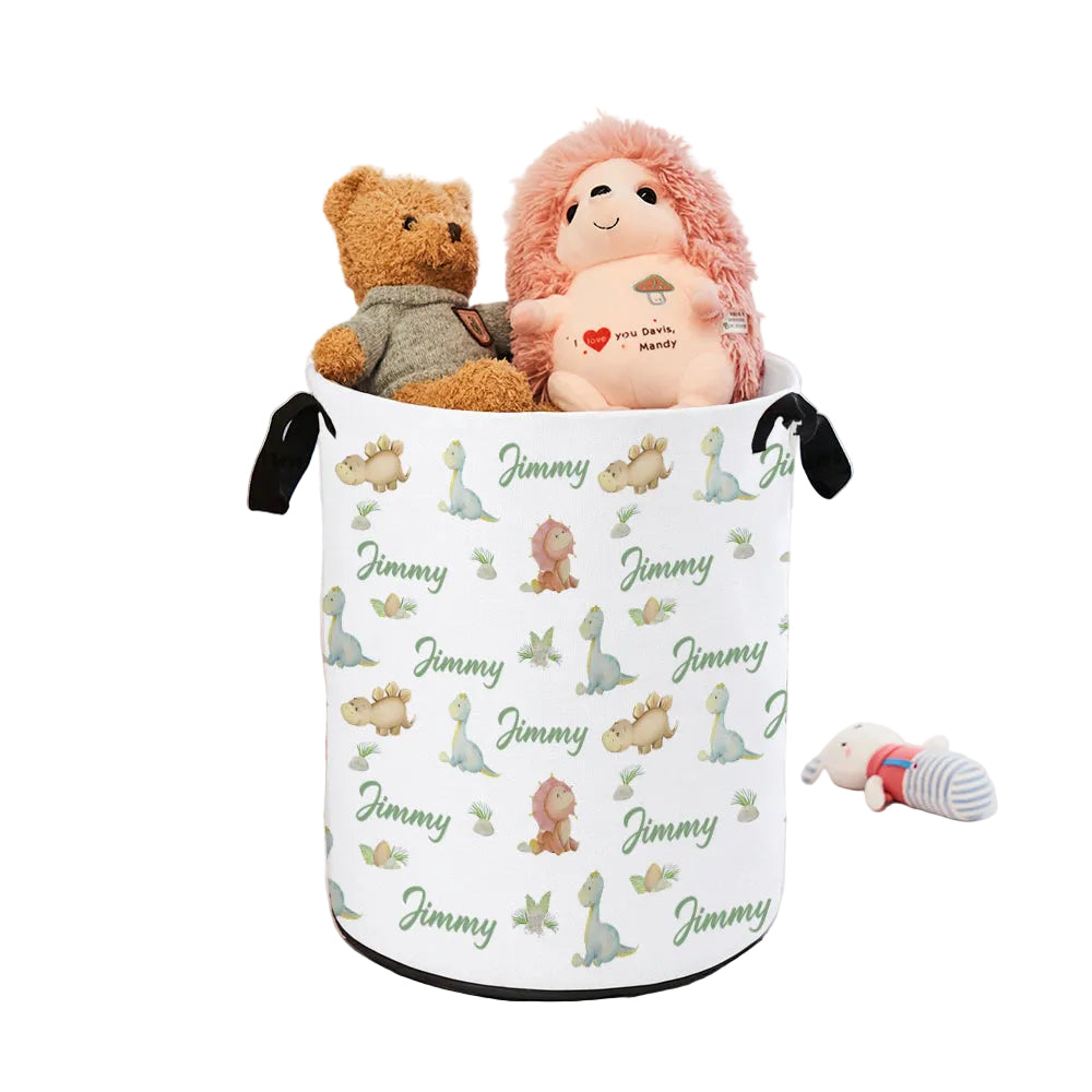 Laundry basket with personalized pattern and name 'Jimmy' on a bed with stuffed toys.