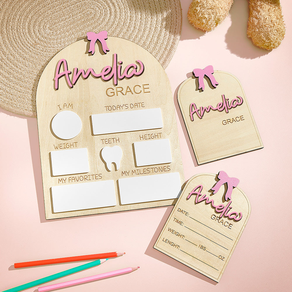 Wooden baby milestone chart with 'Amelia Grace' on a pink background