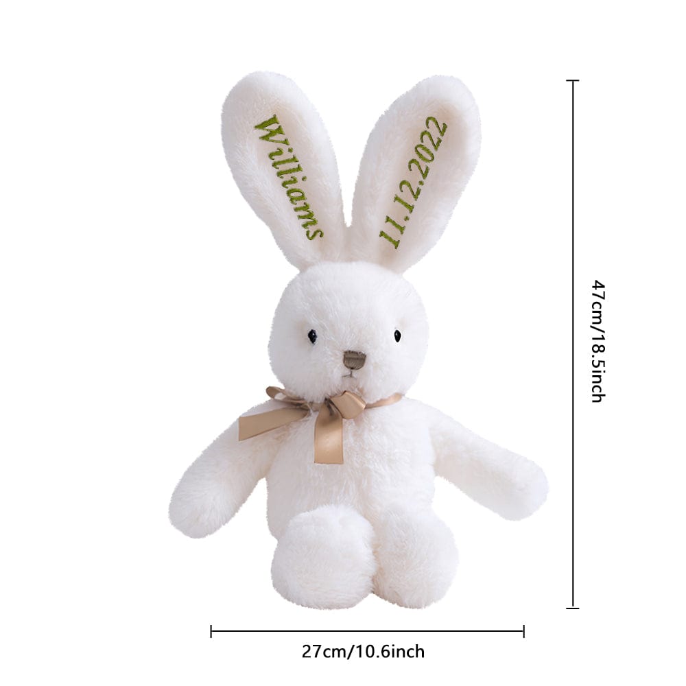 White plush bunny toy with a bow tie and personalized text on ears, shown with dimensions.